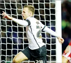  ??  ?? DOUBLE TIME: Derby’s Andreas Weimann celebrates his goal