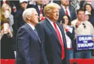  ?? STAFF PHOTO BY DOUG STRICKLAND ?? President Donald Trump stands with Vice President Mike Pence on stage during a rally at McKenzie Arena on Sunday,