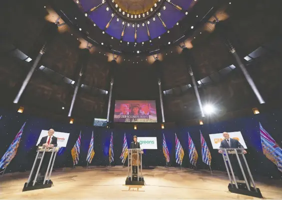  ?? JONATHAN HAYWARD/ THE CANADIAN PRESS ?? Liberal Leader Andrew Wilkinson, left, Green Leader Sonia Furstenau and NDP Leader John Horgan prepare to debate at the Chan Centre Tuesday.