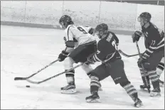  ?? CAROLE MORRIS-UNDERHILL ?? The Leafs’ Wesley Demone managed to steal the puck from Nolan Smith.