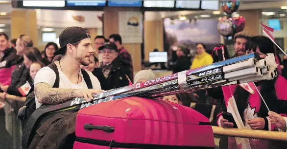  ?? PHOTOS: NICK PROCAYLO ?? Gilbert Brule and other Canadian Olympic athletes return from the Pyeongchan­g Games at Vancouver Internatio­nal Airport in Richmond on Monday.