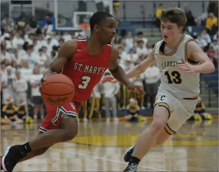  ?? PHOTOS BY KEN SWART — MEDIANEWS GROUP ?? Kareem Rozier (3) of Orchard Lake St. Marys drives past Clarkston’s Caleb Woodbury (13) during the game played on Thursday at Clarkston High School. Rozier had 24 points to help lead the Eaglets to a 60-51 win.