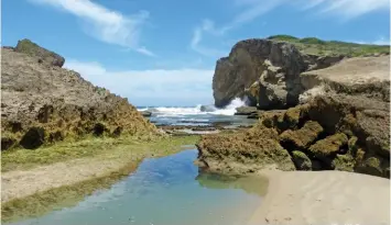  ?? MIKE BURGESS ?? ABOVE: Cove or Gompo Rock, about 15km south-west of East London in the Eastern Cape. In 1819, Xhosa prophet Makhanda Nxele promised that he would jump over a chasm between the two parts of the rock to summon the ancestors from the sea.