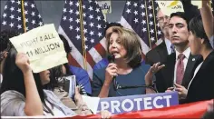  ?? LEA SUZUKI — SAN FRANCISCO CHRONICLE ?? House Minority Leader Nancy Pelosi tries to talk as protesters demonstrat­e Monday during a news conference in San Francisco on the Dream Act.