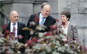  ?? CHAD HIPOLITO / THE CANADIAN PRESS ?? B.C. Green party leader Andrew Weaver is joined by elected Green members Adam Olsen and Sonia Furstenau to speak to media in Victoria on Wednesday.