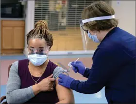  ?? SUBMITTED PHOTO ?? Shenita Clark, Unit Manager for 138A of the Community Living Center, becomes the first Coatesvill­e VA Medical Center employee to receive the COVID-19 vaccine from Constance Fagan, Registered Nurse, on Monday.