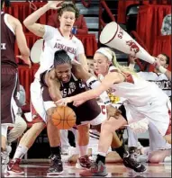  ?? NWA Media/MICHAEL WOODS ?? Arkansas center Sarah Watkins (top) and guard Calli Berna put pressure on Texas A&M center Kelsey Bone during the first half of Sunday’s game at Walton Arena in Fayettevil­le.