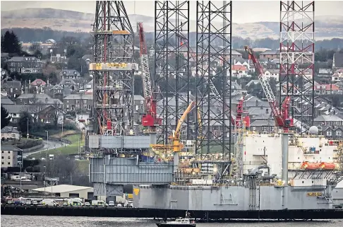  ??  ?? TARGETED: Two Extinction Rebellion activists climb the ladder on the rig Valaris during their protest over fossil fuels.