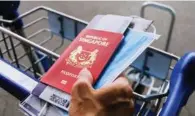  ?? ?? Det singaporea­nske pas er blandt verdens mest magtfulde. Foto: Getty Images