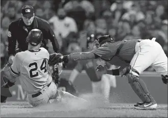  ?? MICHAEL DWYER/AP PHOTO ?? In this Sept. 6, 2019, file photo, Boston Red Sox catcher Christian Vazquez, right, tags out New York Yankees catcher Gary Sanchez (24) during the seventh inning of a game in Boston.