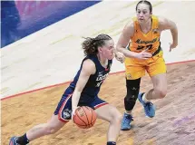  ?? Tyler Sizemore/Hearst Connecticu­t Media ?? UConn guard Ashlynn Shade (12) plays in UConn’s 95-64 win over Marquette at the XL Center in Hartford Dec. 31.