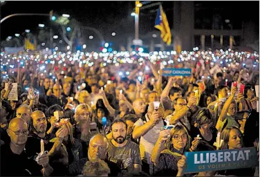  ?? AP/EMILIO MORENATTI ?? Catalans protest Tuesday in Barcelona, Spain, against a Madrid judge’s decision to imprison separatist leaders without bail.