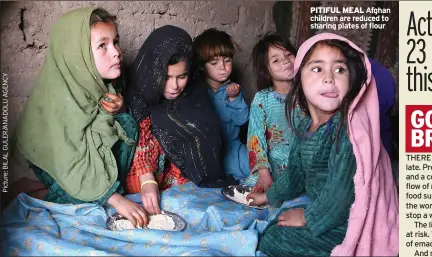  ?? ?? pitiful meal Afghan children are reduced to sharing plates of flour