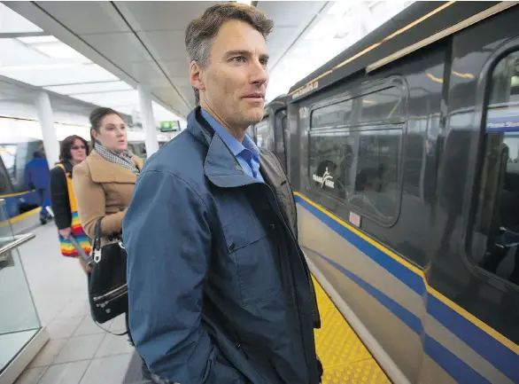  ?? JASON PAYNE ?? Vancouver Mayor Gregor Robertson is known to walk neighbourh­oods, bike to work and take the SkyTrain to meetings as he juggles the various daily duties of his office.