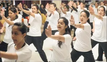  ?? Raveendran AFP/Getty Images ?? FEMALE STAFF members from the Imperial Hotel take a self-defense class in January 2013 in New Delhi.