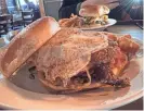  ?? SUSAN STAPLETON/THE REGISTER ?? The hangover burger at Angry Goldfish Pub & Eatery.