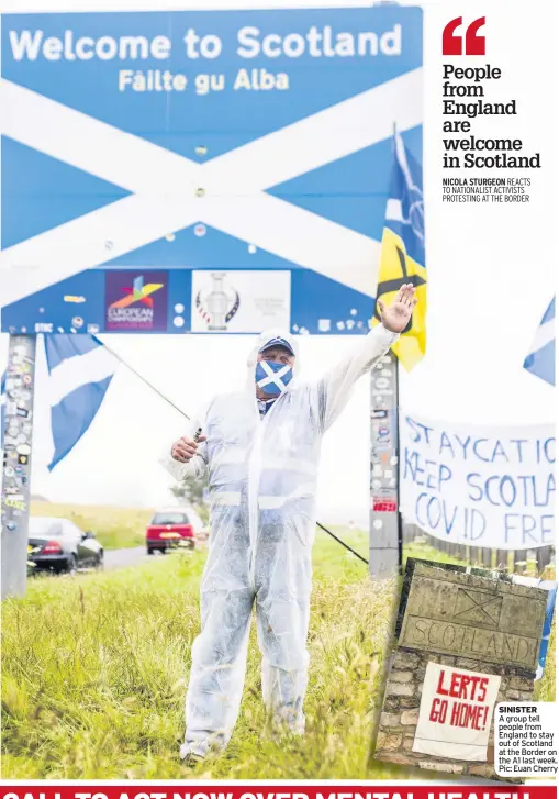  ??  ?? SINISTER A group tell people from England to stay out of Scotland at the Border on the A1 last week. Pic: Euan Cherry