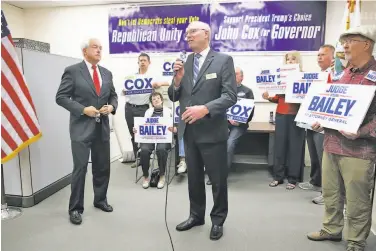  ?? Liz Hafalia / The Chronicle ?? Steve Bailey (center), Republican candidate for attorney general, meets with reporters in Burlingame in May with gubernator­ial candidate John Cox (left). Bailey is facing Democratic incumbent Xavier Becerra.