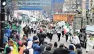  ?? RICK WOOD/MILWAUKEE JOURNAL SENTINEL ?? The Glencastle Irish Dancers, from Franklin, dance and engage the crowd during The Shamrock Club of Wisconsin’s 53rd annual St. Patrick’s Day Parade in 2019 — the last time the parade was held in Milwaukee.