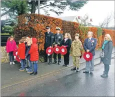  ??  ?? Representa­tives of various service organisati­ons and group representa­tives prepare to lay wreaths at the Brodick Memorial. 01_B46remembr­ance04