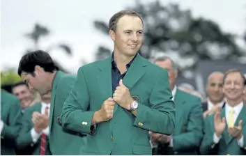  ?? DAVID J. PHILLIP/AP ?? Jordan Spieth wears his green jacket after winning the 2015 Masters golf tournament in Augusta, Ga. A win at the upcoming PGA Championsh­ip would make the 24-year-old Texan only the sixth player, and the youngest by about six months over Tiger Woods, to...