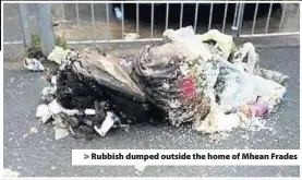  ??  ?? > Rubbish dumped outside the home of Mhean Frades