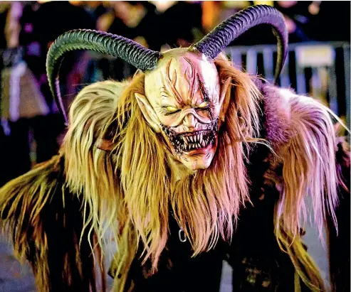  ??  ?? Men and women dress up as pagan Krampus figures to scare people in Hollabrunn, Austria.