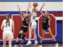  ?? DAVID DALTON — FOR MEDIANEWS GROUP ?? Ford’s Madison Bettys (22) and Anayya Davis (24) play defense during the MAC Red/White tournament final against Grosse Pointe North on Feb. 18, 2023. Bettys and Davis were named Macomb County Tier 1co-Players of the Year.