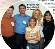  ??  ?? Brit with her parents and siblings