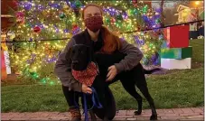  ?? SUBMITTED PHOTO ?? Brenna with her dog, Bella, wearing matching mask/bandana from The Total Animal at Peddler’s Village