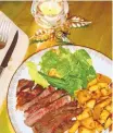  ?? LINDA GASSENHEIM­ER/TNS ?? Glazed garlic ginger steak and potatoes are quick enough for a weeknight dinner.
