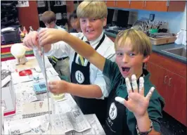  ??  ?? Things got a little messy for a good cause, when Briarcrest Christian School middle school art students Parker Oglesby and Jack Jobe created the design for their lamb during a class project teaching the value of teamwork, the effectiven­ess of using art...