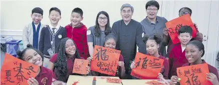  ?? Photos: Xinhua ?? Students from Beijing and Medgar Evers College Preparator­y School of New York take a group photo after a culture exchange event in New York, the United States on February 2, 2018.