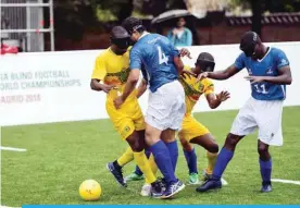  ?? — AFP ?? MADRID: Blind football players vie during the match Brazil against Mali of the Internatio­nal Blind Sports Federation’s Blind Football World Championsh­ips in Madrid on Friday.