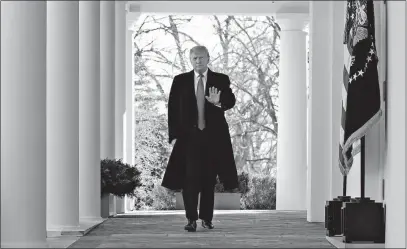  ?? [JACQUELYN MARTIN/THE ASSOCIATED PRESS] ?? President Donald Trump waves Friday as he walks from the Oval Office to the Rose Garden to announce an agreement to reopen the government.