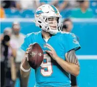  ?? BRYNN ANDERSON/AP ?? David Fales, above, and Brock Osweiler impressed so much during the offseason, Dolphins coaches decided to carry three quarterbac­ks on the roster for this first time since 2008.