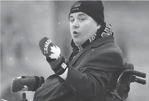  ?? JUSTIN TANG / THE CANADIAN PRESS ?? Minister of Sport and Persons with Disabiliti­es Kent Hehr addresses the official inaugurati­on of the Canada 150 Rink on Parliament Hill Thursday.