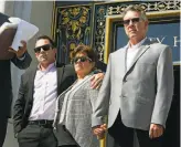  ?? Liz Hafalia / The Chronicle ?? Brother Brad Steinle (left), Liz Sullivan (middle) and Jim Steinle (right), parents of Kathryn Steinle, watch as their attorney announces filing claims in the July 1 killing.