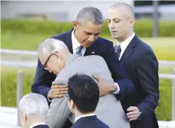  ??  ?? In this file photo, US President Barack Obama hugs Shigeaki Mori, an atomic bomb survivor; creator of the memorial for American WWII POWs killed at Hiroshima, during a ceremony at Hiroshima Peace Memorial Park in Hiroshima, western, Japan. — AP
