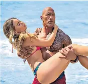  ??  ?? Dwayne Johnson keeps the beaches of California safe, but can do nothing to breathe life into Baywatch the movie