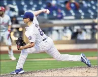  ?? Elsa / Getty Images ?? Trevor May of the New York Mets delivers a pitch in the eighth inning against the Philadelph­ia Phillies during the first game of a doublehead­er at Citi Field on Tuesday in New York.