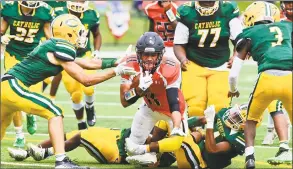  ?? Matthew Brown / Hearst Connecticu­t Media ?? Stamford’s Lenny Garcia is stopped short of a first down by Trinity Catholic during the third quarter of the Black Knights’ 19-7 victory Saturday.