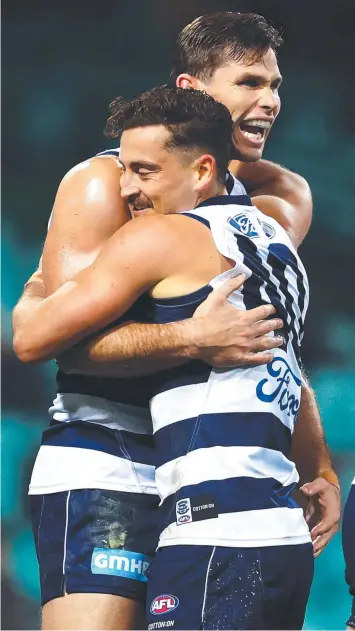  ?? Picture: GETTY IMAGES ?? LOVE CATS: Geelong’s Tom Hawkins celebrates a goal with Luke Dahlhaus