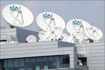  ?? Luca Bruno Associated Press ?? LICENSING contracts with Sky UK prohibit viewers who travel outside Britain and Ireland from accessing Sky UK’s programmin­g via satellite or the Internet. Above, Italian Sky television in Milan, Italy.