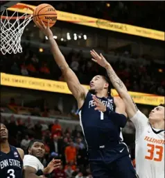  ?? Quinn Harris/Getty Images ?? Seth Lundy, left, had 17 points and 10 rebounds for Penn State in a 79-76 win against Illinios Thursday night in the Big Ten tournament in Chicago.