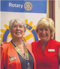  ??  ?? ●●Bernadette Holgate (right) presenting the president’s chain to Linda Mullins