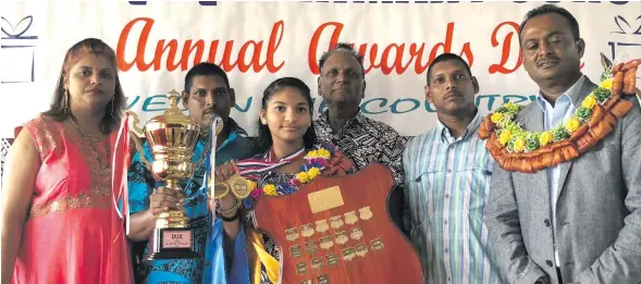  ?? Photo: Sheenam Chandra ?? From left: Devina Devi, Ram Sudesh Singh, dux award winner Kajol Kavita Singh, Abhay Singh, Ram Hirdesh Singh and Assistant Minister for Infrastruc­ture and Transport Vijay Nath at Koroqaqa Primary School in Naitasiri on November 10, 2018.