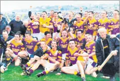  ?? ?? St Catherines celebrate county final success in 2004, kneeling in front on immediate right is club president Dick Morrison, who sadly passed away recently. Adjacent to Dick is his son Kieran.