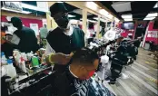  ?? JULIO CORTEZ — THE ASSOCIATED PRESS ?? Wallace Wilson, top, cuts the hair of James McRae, Friday in Hyattsvill­e, Md. Wilson is a member of the Health Advocates In Reach & Research (HAIR) program, which helps barbers and hair stylists to get certified to talk to community members about health.