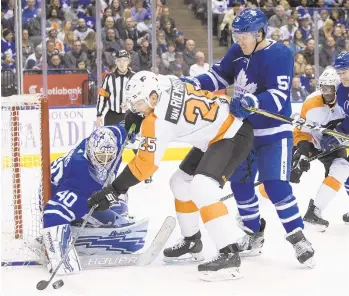  ?? CHRIS YOUNG/AP ?? Flyers winger James van Riemsdyk (center) returned to face the Leafs for the first time. He played six seasons in blue and white before signing a five-year, $35 million contract with Philadelph­ia on July 1.